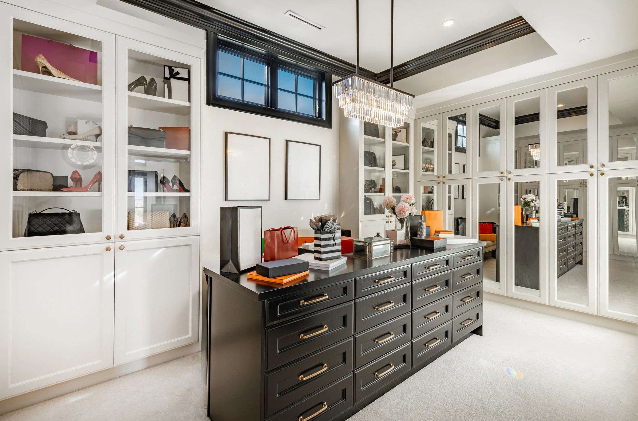 Elegant reach-in closet with white shelving and organization